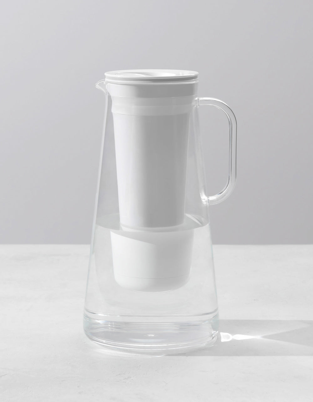Small Glass Pitcher with a large heavy silver spout