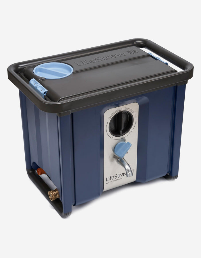 LifeStraw Max high-capacity water purifier in navy blue, angled view showing mode dial and steel tap
