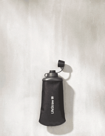 Overhead view of the LifeStraw Peak collapsible squeeze bottle in gray with its leakproof cap flipped open